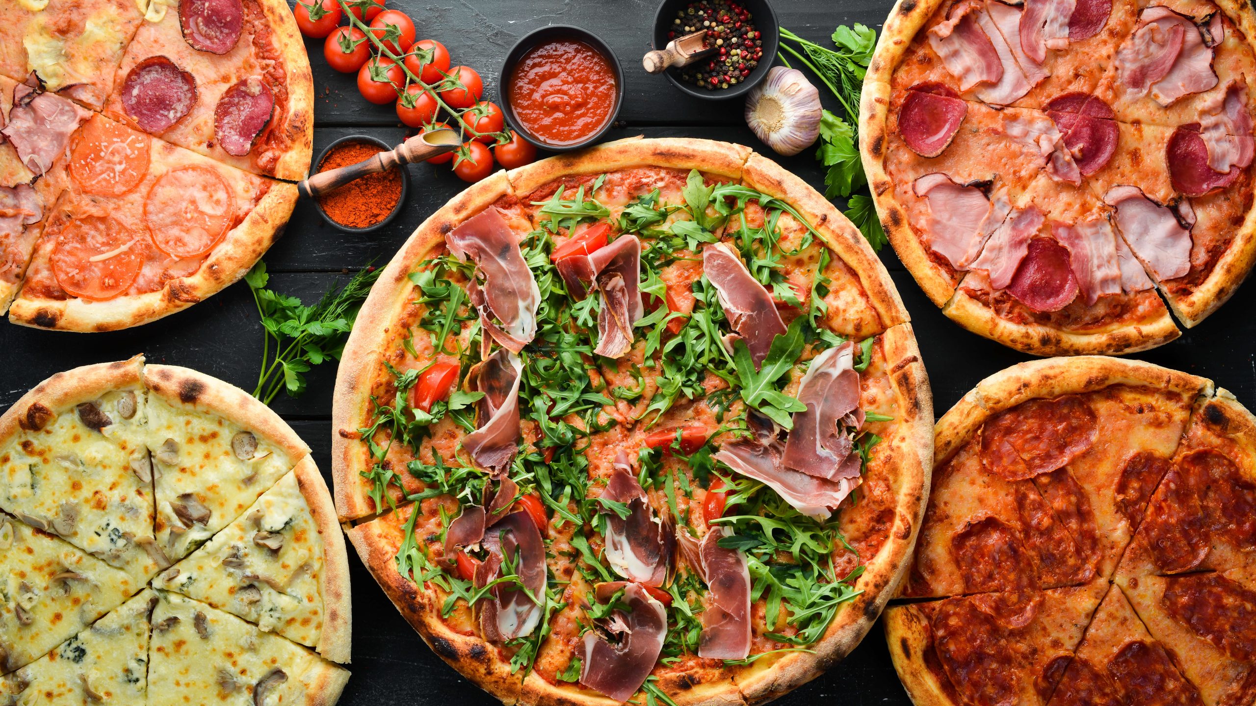 delicious-pizza-assortment-pizza-pieces-top-view-free-space-your-text